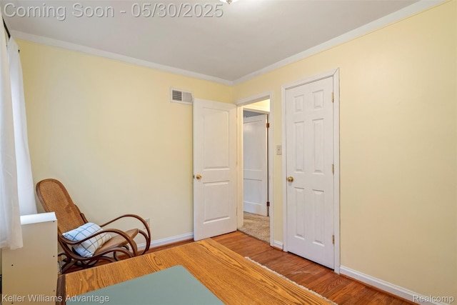 22810 Lilac St, Farmington, MI 48336 - sitting room featuring wood finished floors, crown molding, and baseboards