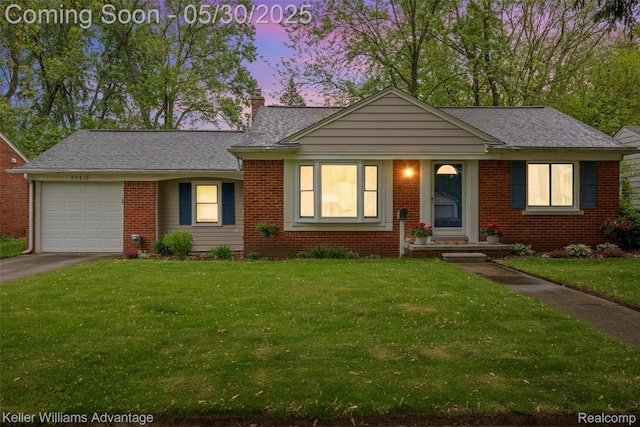 22810 Lilac St, Farmington, MI 48336 - view of front of property with an attached garage, asphalt driveway, a front lawn, and brick siding