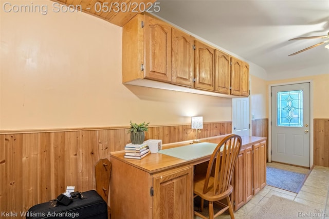 22810 Lilac St, Farmington, MI 48336 - home office with wainscoting, a ceiling fan, wood walls, and light tile patterned floors