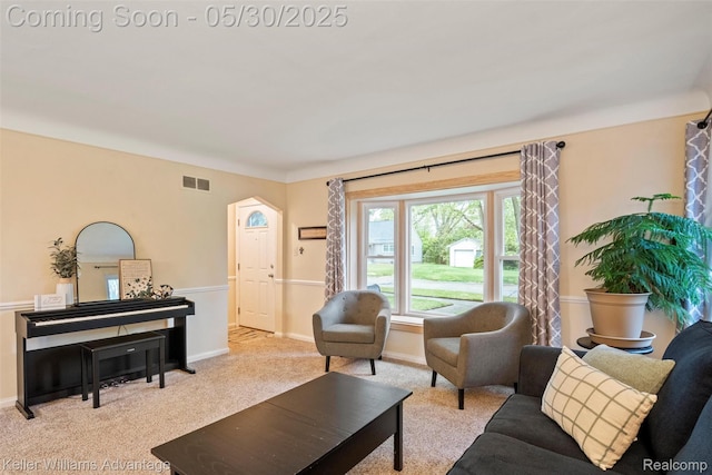 22810 Lilac St, Farmington, MI 48336 - living area with carpet, arched walkways, and baseboards