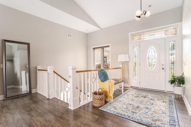 9077 24th Ave, Jenison, MI 49428 - entryway with wood finished floors, high vaulted ceiling, baseboards, and a chandelier