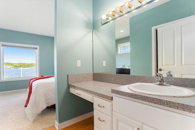 9077 24th Ave, Jenison, MI 49428 - bathroom with vanity and baseboards