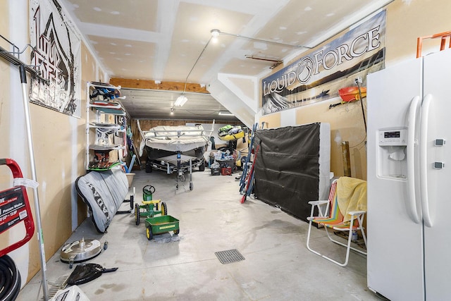 9077 24th Ave, Jenison, MI 49428 - garage with white refrigerator with ice dispenser