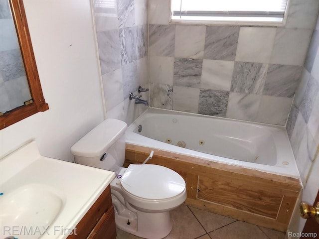 24449 Lauren Ave, Warren, MI 48089 - bathroom featuring toilet, a tub with jets, vanity, and tile patterned floors