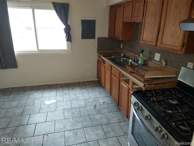 24449 Lauren Ave, Warren, MI 48089 - kitchen with gas range, a sink, electric panel, and backsplash