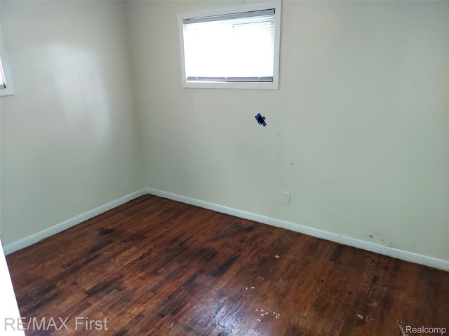 24449 Lauren Ave, Warren, MI 48089 - unfurnished room with wood finished floors and baseboards