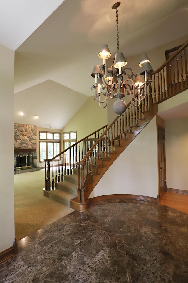 10466 W Farrand Rd, Montrose, MI 48457 - stairs featuring a chandelier, baseboards, a fireplace, and a towering ceiling