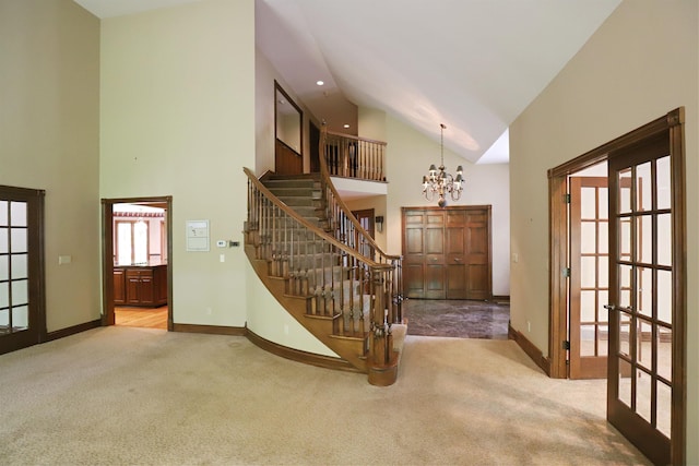 10466 W Farrand Rd, Montrose, MI 48457 - entrance foyer featuring high vaulted ceiling, carpet, a chandelier, stairs, and baseboards