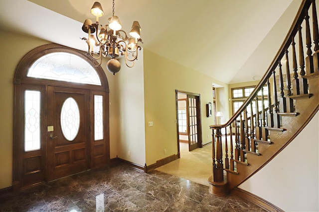 10466 W Farrand Rd, Montrose, MI 48457 - foyer entrance featuring marble tiled floors, baseboards, high vaulted ceiling, a chandelier, and stairs