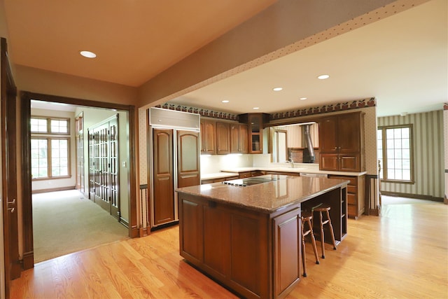 10466 W Farrand Rd, Montrose, MI 48457 - kitchen with paneled built in refrigerator, light wood-style floors, a center island, plenty of natural light, and recessed lighting
