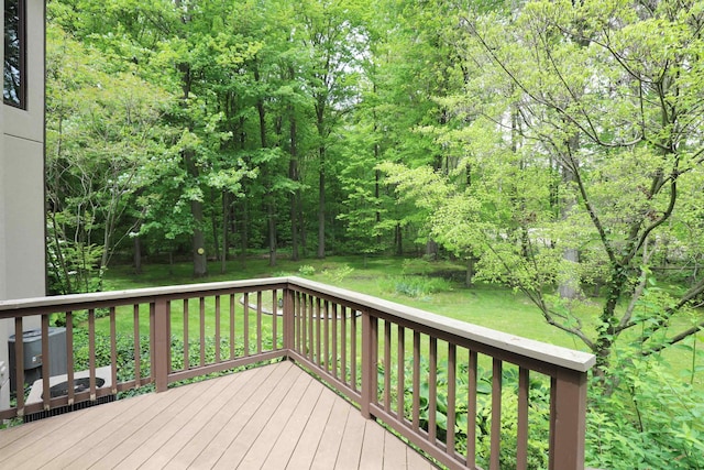 10466 W Farrand Rd, Montrose, MI 48457 - wooden deck with a lawn and central AC unit