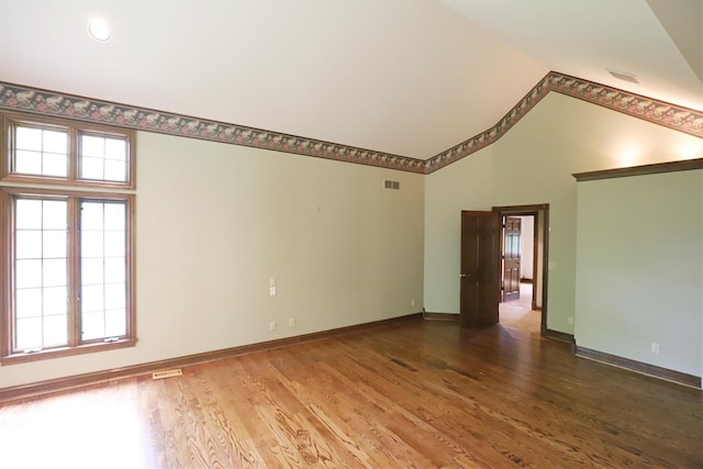10466 W Farrand Rd, Montrose, MI 48457 - empty room with wood finished floors, baseboards, and high vaulted ceiling