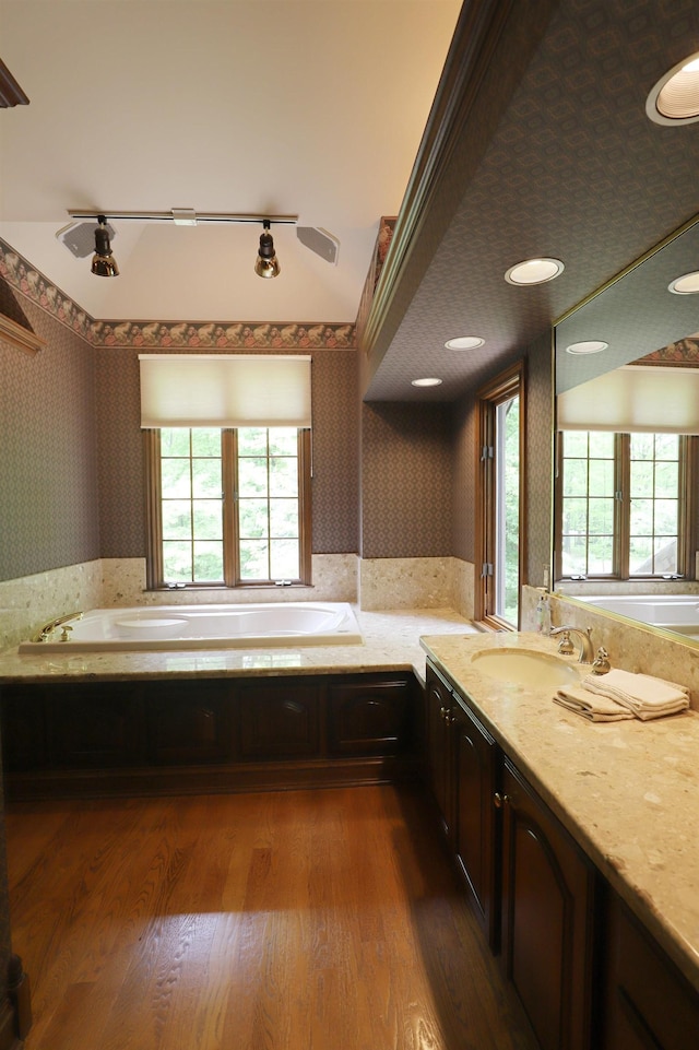 10466 W Farrand Rd, Montrose, MI 48457 - full bath featuring a bath, wallpapered walls, vanity, and wood finished floors