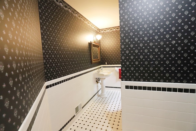 10466 W Farrand Rd, Montrose, MI 48457 - bathroom with wallpapered walls and a wainscoted wall