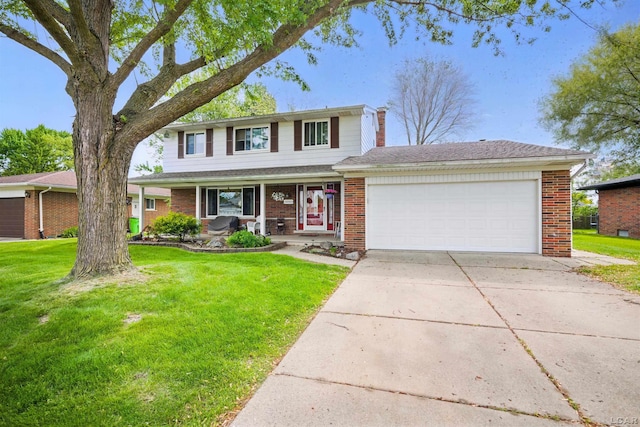 39582 Tunstall St, Clinton Township, MI 48038 - traditional-style house with brick siding, a garage, concrete driveway, and a front yard