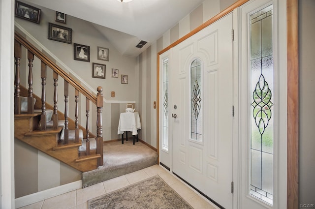 39582 Tunstall St, Clinton Township, MI 48038 - foyer featuring lofted ceiling, light tile patterned floors, stairway, and baseboards