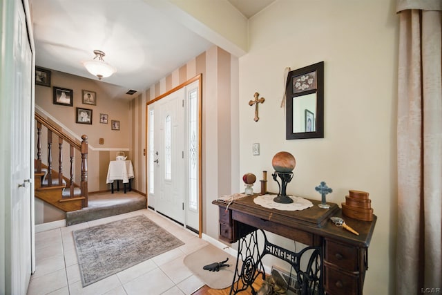 39582 Tunstall St, Clinton Township, MI 48038 - foyer entrance with stairway, light tile patterned floors, and baseboards