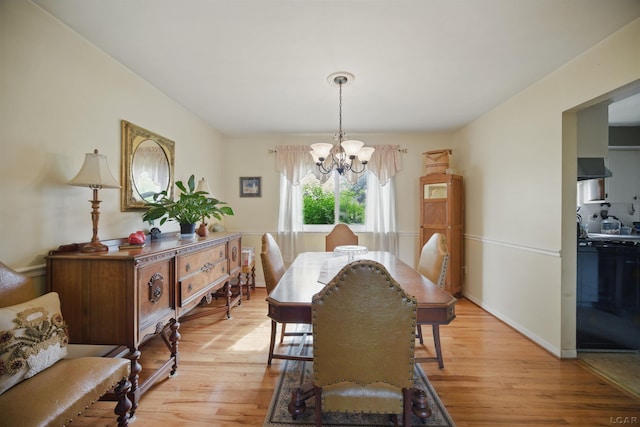 39582 Tunstall St, Clinton Township, MI 48038 - dining room with a chandelier and light wood-style floors