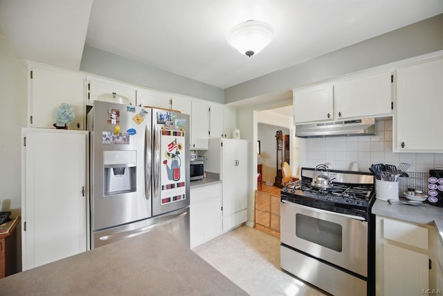 39582 Tunstall St, Clinton Township, MI 48038 - kitchen with appliances with stainless steel finishes, under cabinet range hood, tasteful backsplash, white cabinets, and light countertops