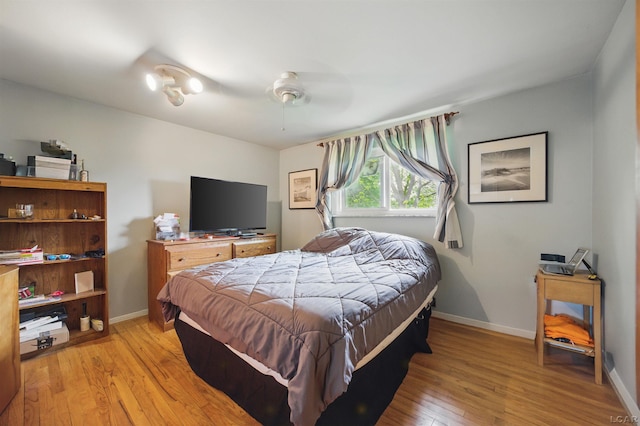 39582 Tunstall St, Clinton Township, MI 48038 - bedroom with light wood-style flooring, baseboards, and ceiling fan