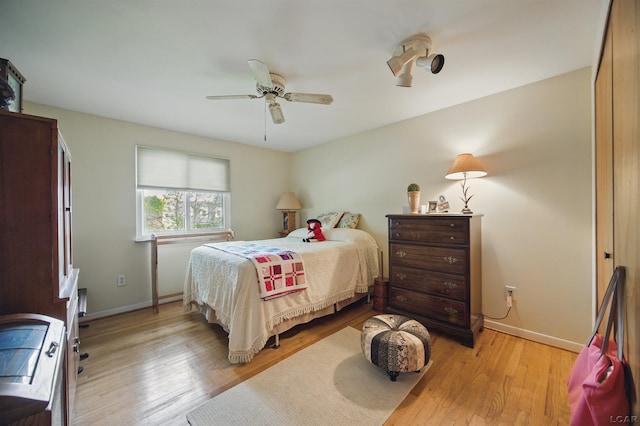 39582 Tunstall St, Clinton Township, MI 48038 - bedroom with light wood-type flooring, baseboards, and a ceiling fan