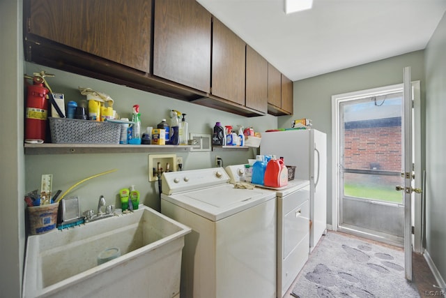 39582 Tunstall St, Clinton Township, MI 48038 - laundry room with washing machine and dryer, cabinet space, and baseboards