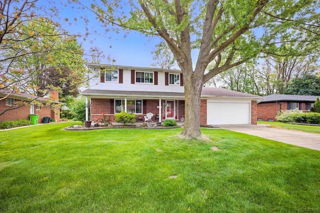 39582 Tunstall St, Clinton Township, MI 48038 - traditional home with brick siding, driveway, a front lawn, and a garage