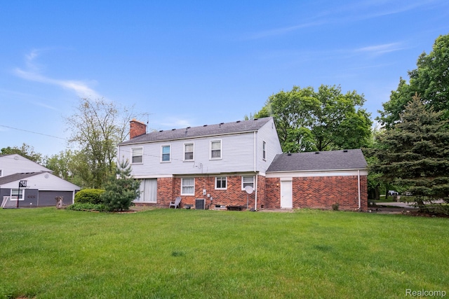 4603 Hedgewood, Bloomfield Hills, MI 48301 - rear view of house featuring a chimney, a yard, and brick siding