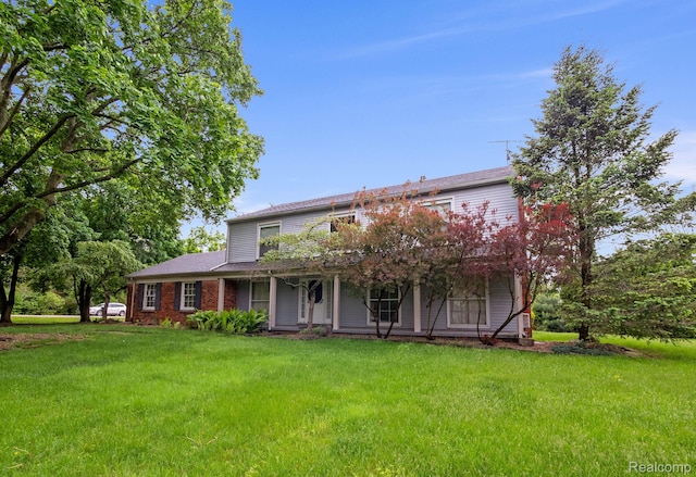 4603 Hedgewood, Bloomfield Hills, MI 48301 - rear view of property with a lawn and covered porch