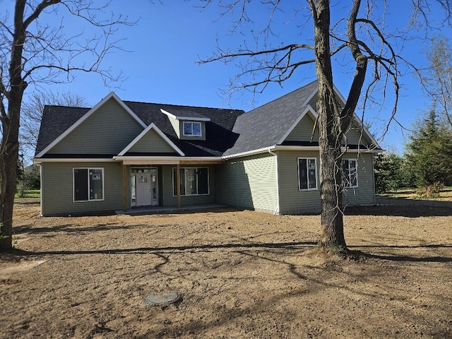 8812 Walsh Ct, Onsted, MI 49265 - view of front of home featuring covered porch and a shingled roof