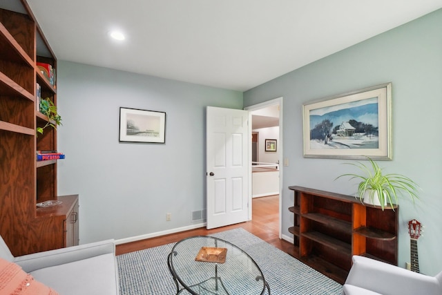 3805 Penberton Ct, Ann Arbor, MI 48105 - living area featuring wood finished floors, recessed lighting, and baseboards