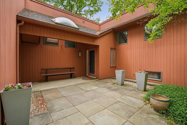 3805 Penberton Ct, Ann Arbor, MI 48105 - view of exterior entry featuring a patio area and roof with shingles