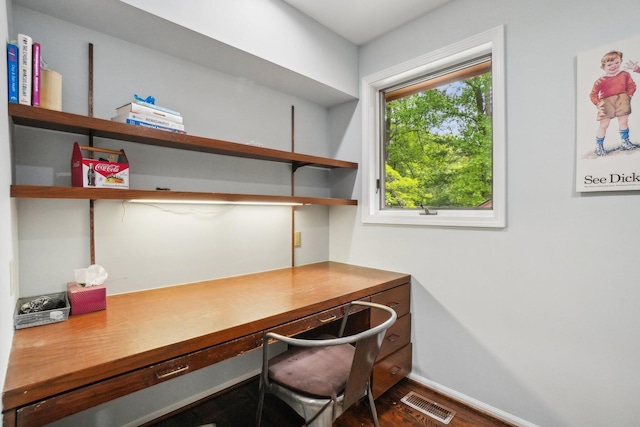 3805 Penberton Ct, Ann Arbor, MI 48105 - office area with built in desk, dark wood-style floors, and baseboards