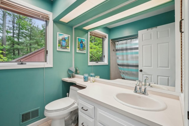 3805 Penberton Ct, Ann Arbor, MI 48105 - bathroom featuring plenty of natural light, toilet, vanity, and a shower with curtain