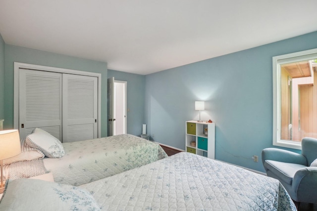 3805 Penberton Ct, Ann Arbor, MI 48105 - bedroom featuring a closet and baseboards