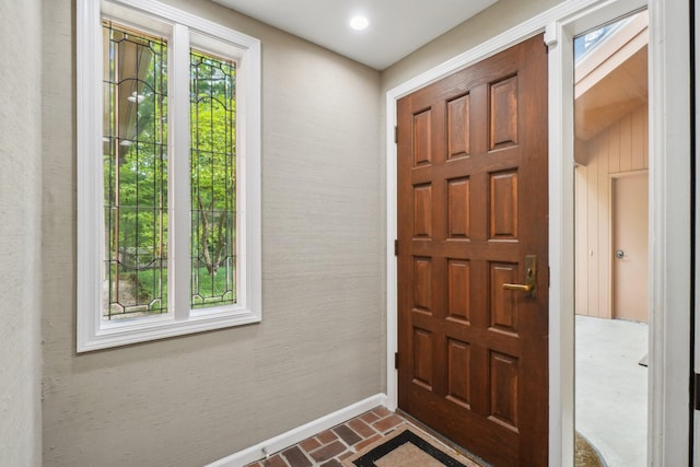 3805 Penberton Ct, Ann Arbor, MI 48105 - entryway featuring brick floors, healthy amount of natural light, and baseboards