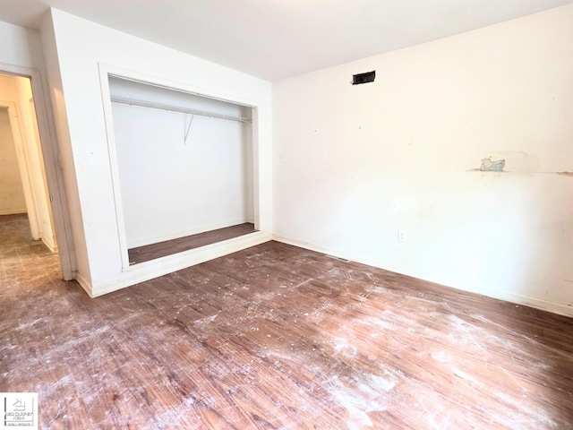 3416 Willard Rd, Birch Run, MI 48415 - unfurnished bedroom with wood finished floors and a closet