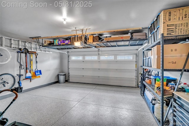 8811 Pioneer St, Washington, MI 48094 - garage with a garage door opener and baseboards