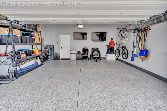 8811 Pioneer St, Washington, MI 48094 - garage with baseboards and a garage door opener
