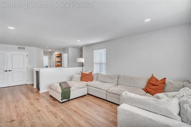 8811 Pioneer St, Washington, MI 48094 - living room featuring light wood finished floors, recessed lighting, and baseboards