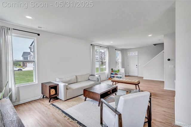 8811 Pioneer St, Washington, MI 48094 - living room featuring light wood finished floors, baseboards, and recessed lighting