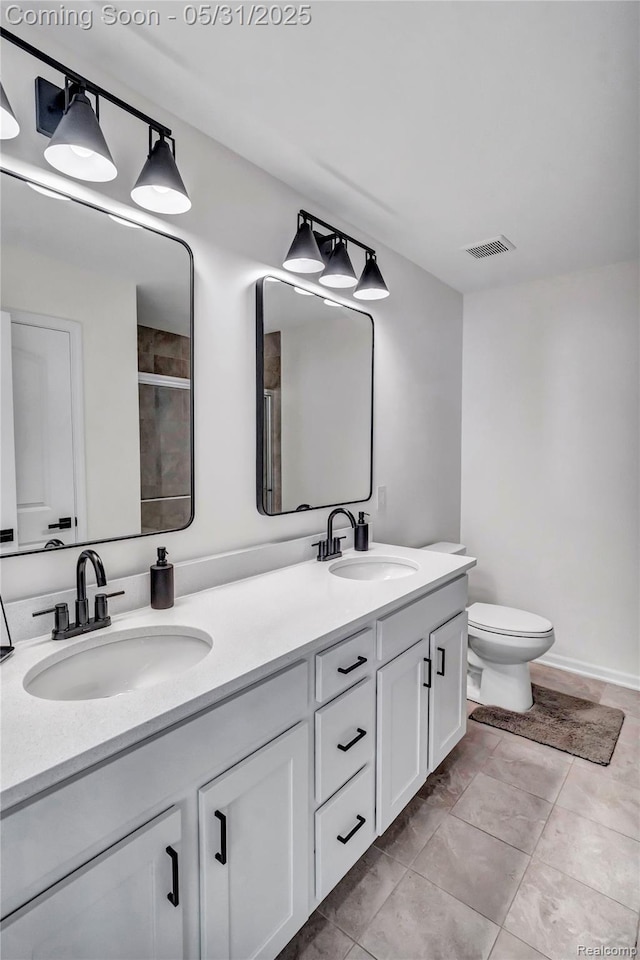 8811 Pioneer St, Washington, MI 48094 - bathroom featuring double vanity, toilet, and a shower