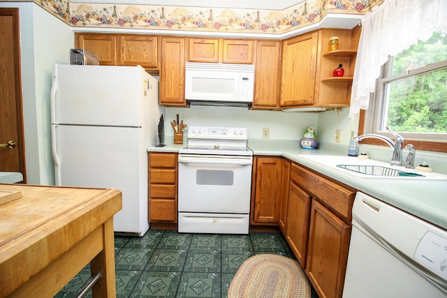21729 Pinhook Rd, Mendon, MI 49072 - kitchen with white appliances, a sink, dark floors, open shelves, and brown cabinetry