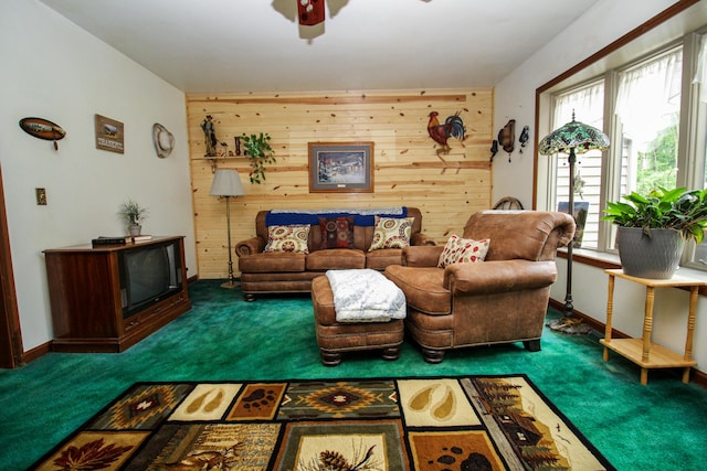 21729 Pinhook Rd, Mendon, MI 49072 - carpeted living area featuring wood walls and a ceiling fan