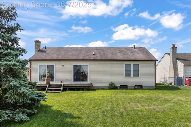 17509 Yaneev Dr, Macomb, MI 48044 - back of property with a deck and a chimney