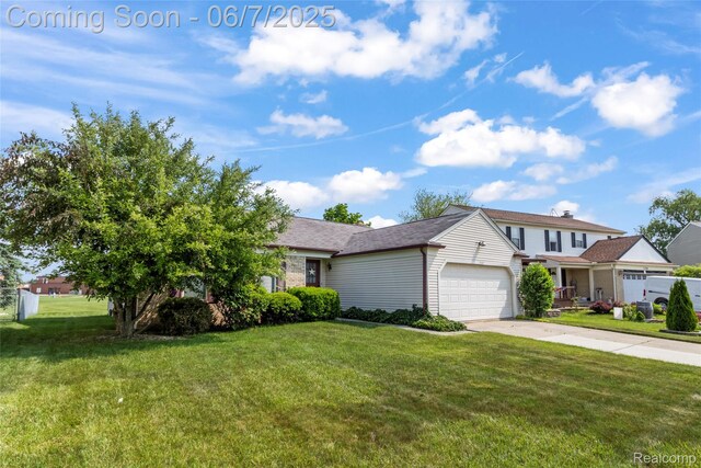 17509 Yaneev Dr, Macomb, MI 48044 - view of front of property with a garage, a front lawn, and concrete driveway