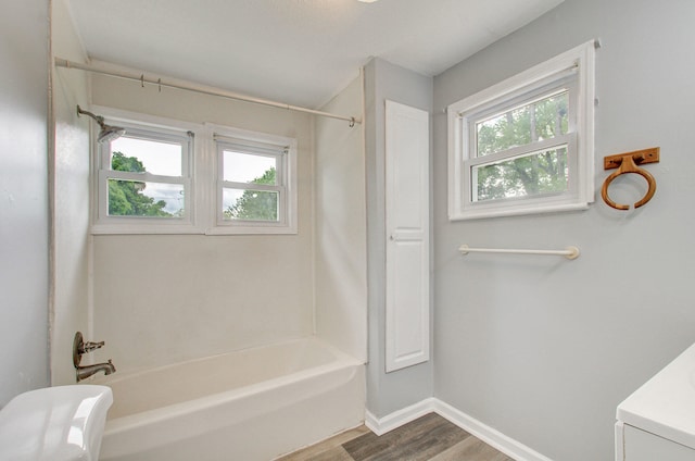 157 E Mansion St, Jackson, MI 49203 - full bath with wood finished floors, baseboards, tub / shower combination, and vanity