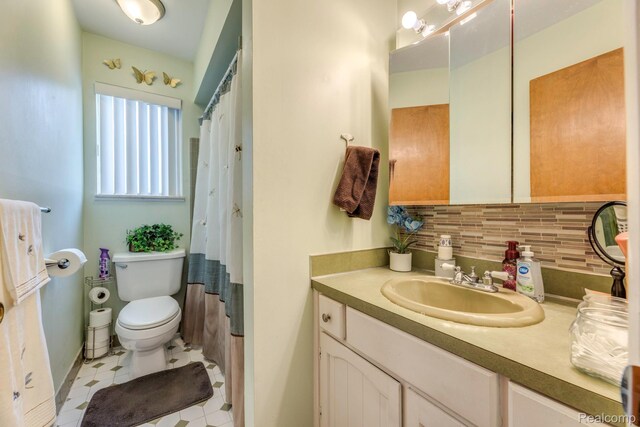 34043402 Appomattox Dr, Port Huron, MI 48060 - full bathroom with tasteful backsplash, vanity, toilet, a shower with shower curtain, and baseboards