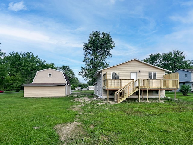 5098 N Center Rd, Flint, MI 48506 - back of property with a wooden deck, a lawn, stairway, and an outdoor structure