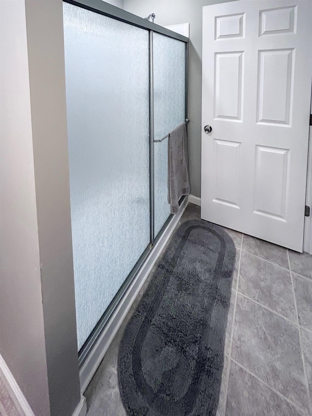5098 N Center Rd, Flint, MI 48506 - full bathroom with a shower stall and baseboards